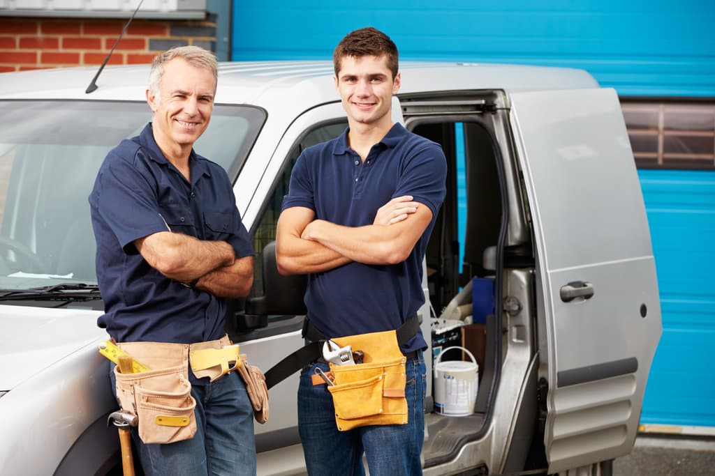 Noble Heating and Plumbing team standing by service van